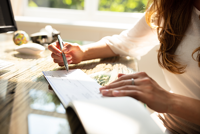 woman writing checks